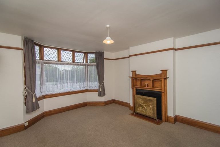 Lounge with bay window and fireplace
